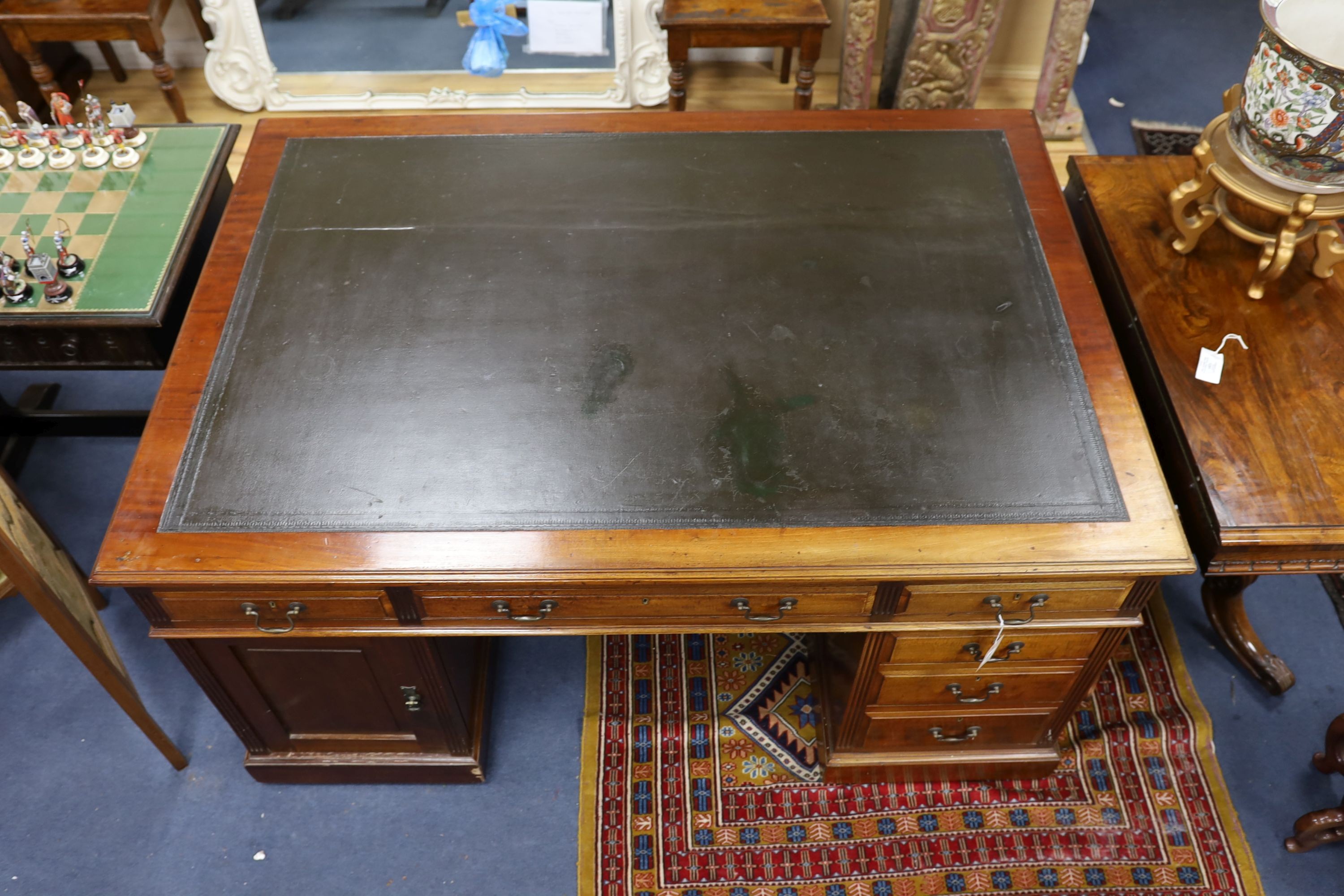 A Victorian mahogany pedestal partner's desk by Maple & Co., length 152cm, depth 105cm, height 78cm